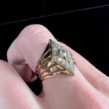 An estate ladies' gold diamond ring.  The shape of the ring resembles an art deco style diamond.
