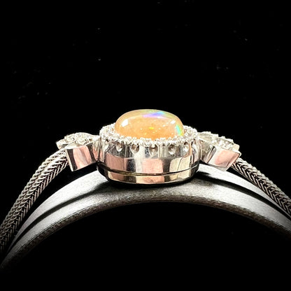 A Virgin Valley fire opal and diamond bracelet made from a vintage 1930's watch.