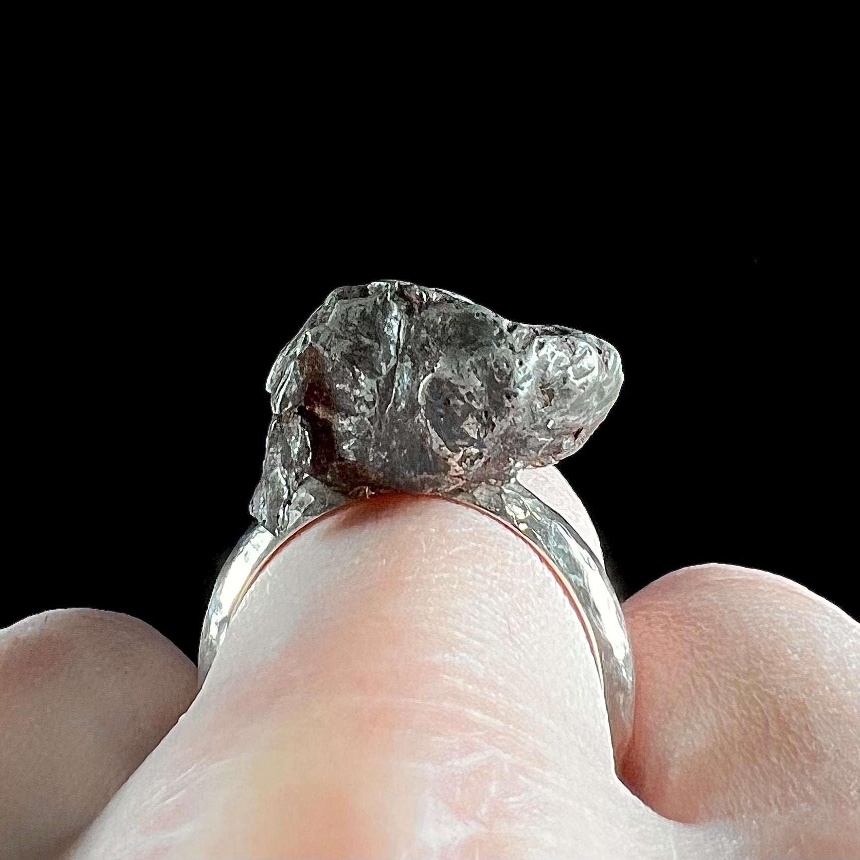 Engagement ring with meteorite stone