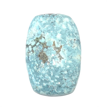 A loose, barrel cabochon cut turquoise stone from Baja California.  The piece is light blue with a gray matrix.