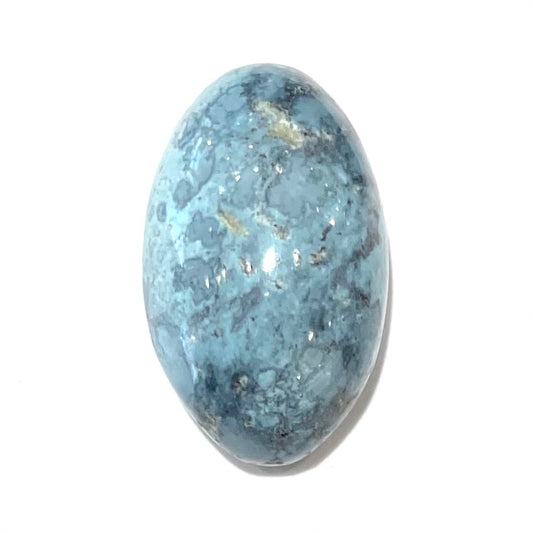 A loose, oval cabochon cut turquoise stone from Baja California.