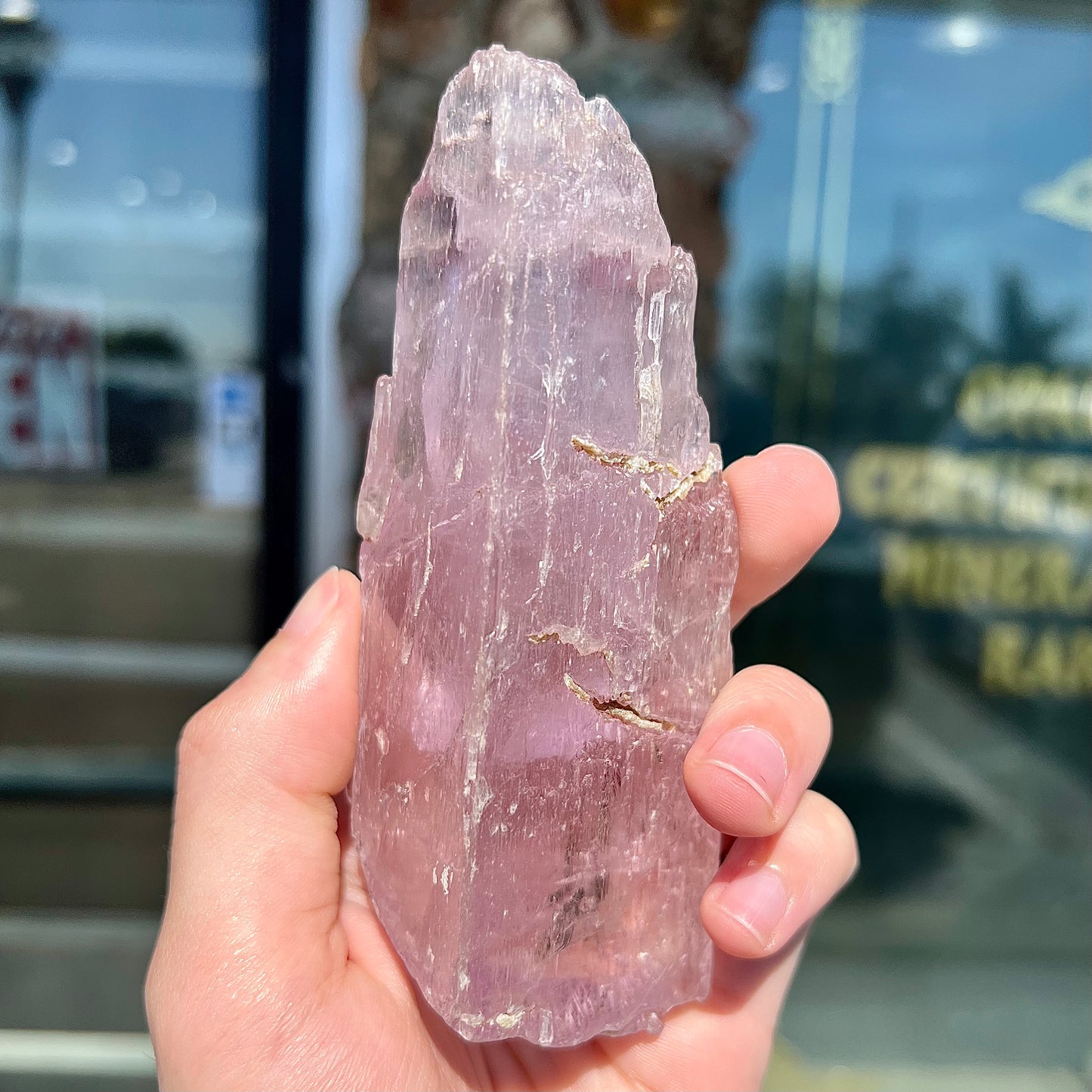 A large, pink kunzite crystal specimen.