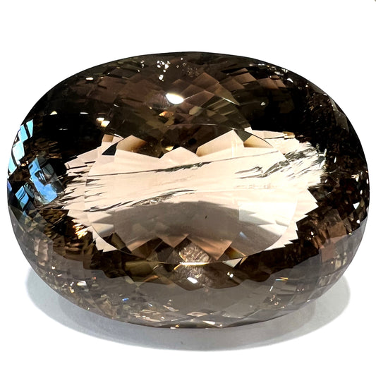 A loose, 1400+ carat smoky quartz gemstone.  The stone has a fracture that runs throughout the stone to the table.