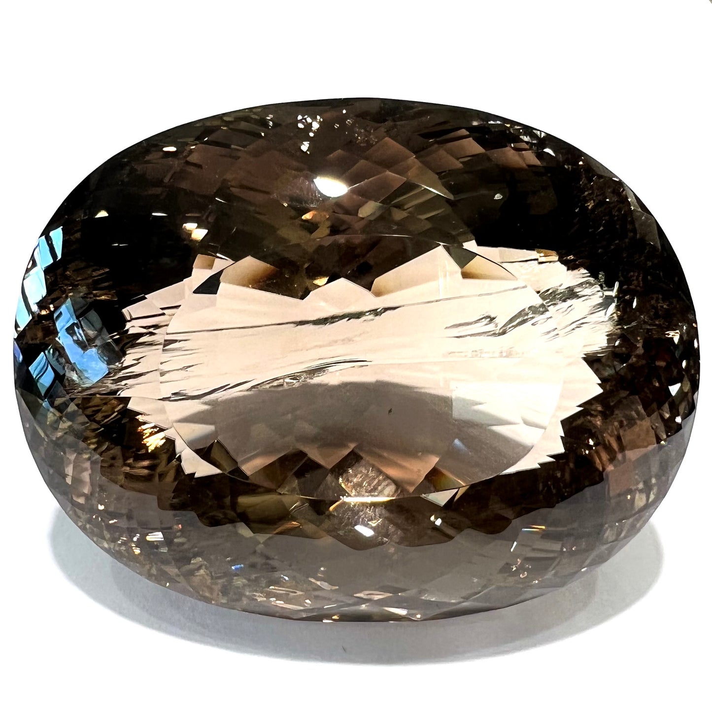 A loose, 1400+ carat smoky quartz gemstone.  The stone has a fracture that runs throughout the stone to the table.