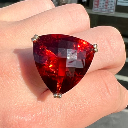 A ladies' trillion cut madeira citrine cocktail ring handmade in yellow gold.
