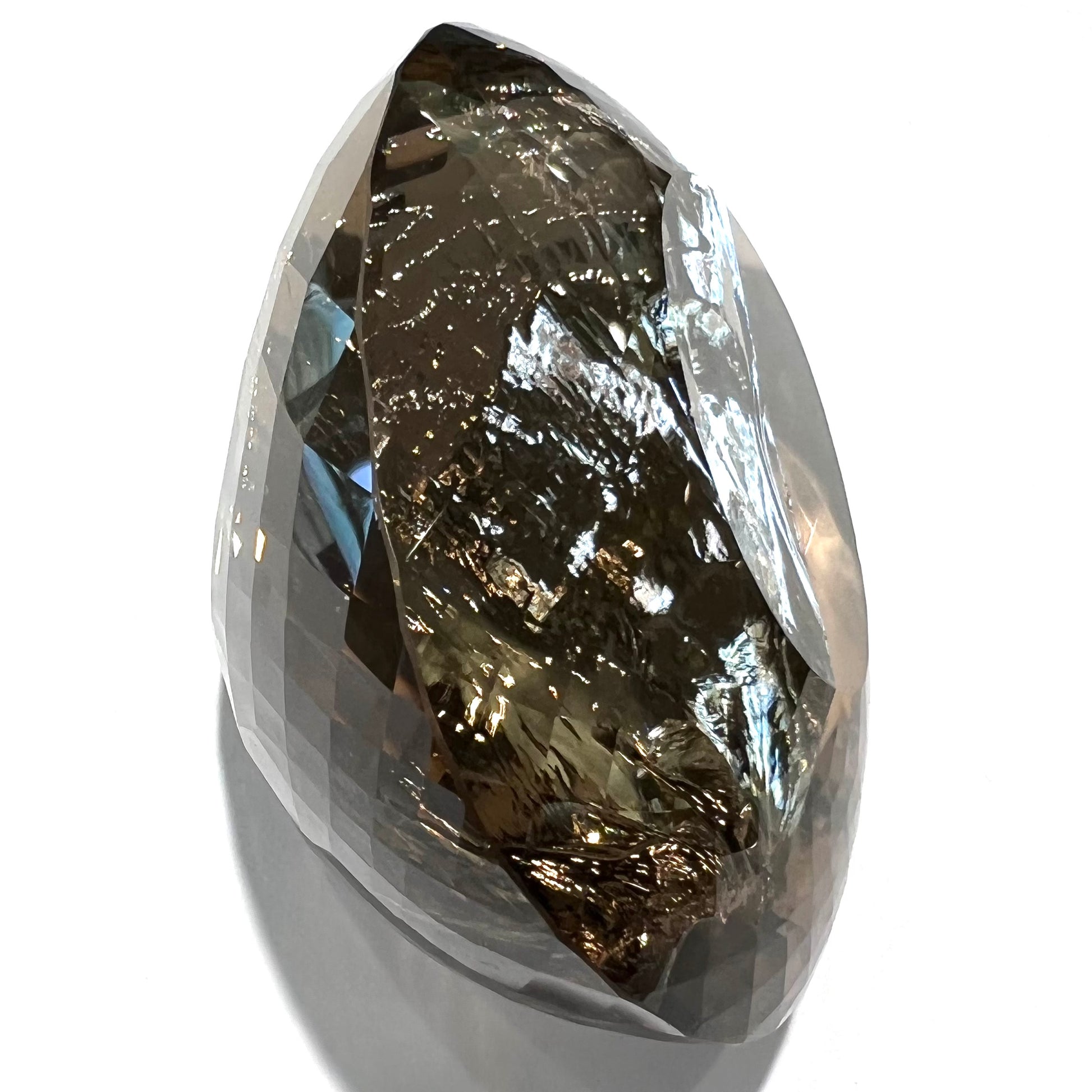 A loose, 1400+ carat smoky quartz gemstone.  The stone has a fracture that runs throughout the stone to the table.