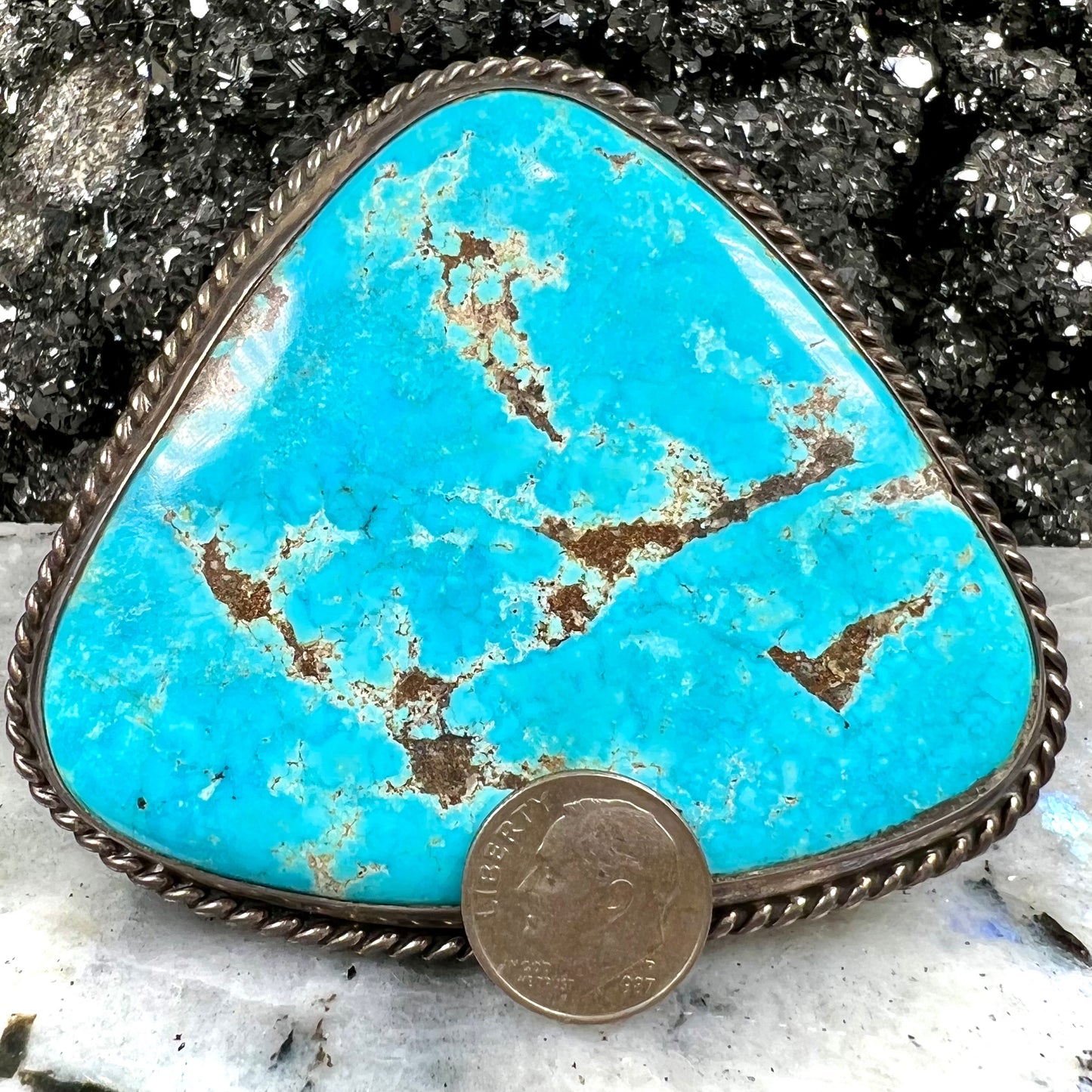 A sterling silver Morenci turquoise cuff bracelet.  The turquoise is large and has orange copper veins.
