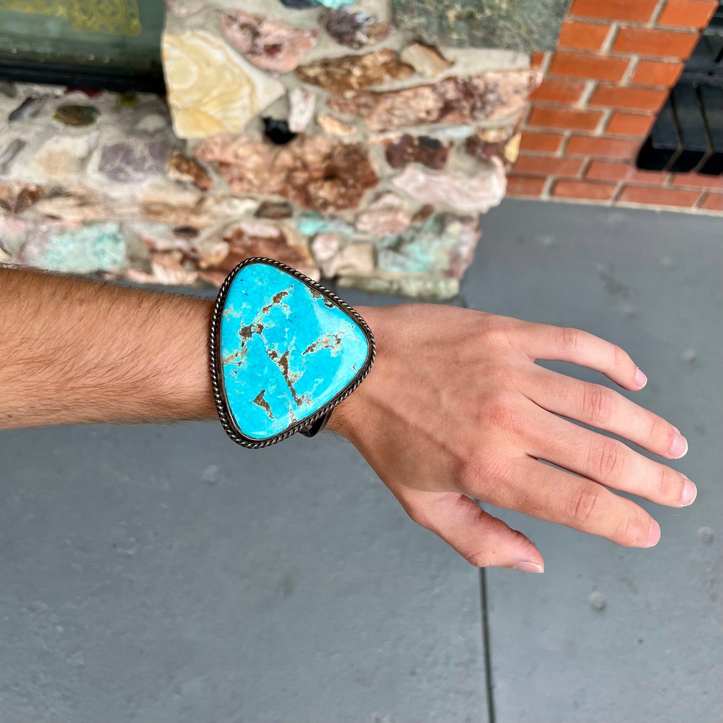 A sterling silver Morenci turquoise cuff bracelet.  The turquoise is large and has orange copper veins.