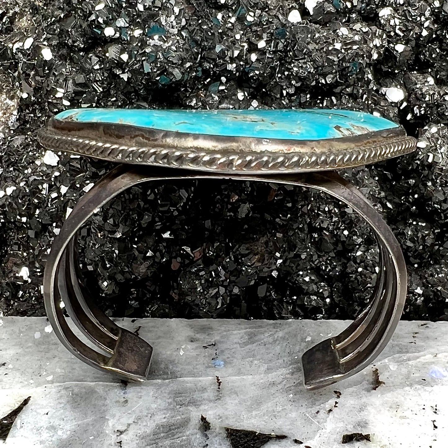 A sterling silver Morenci turquoise cuff bracelet.  The turquoise is large and has orange copper veins.