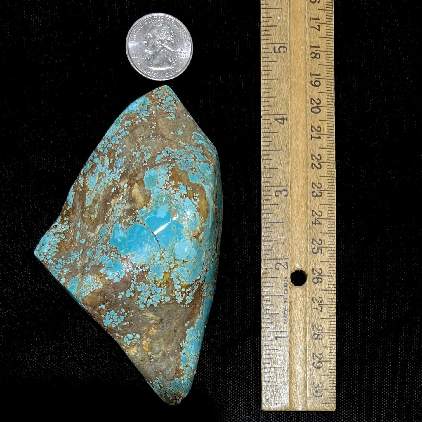 A polished Cripple Creek turquoise nugget from Teller County, Colorado.
