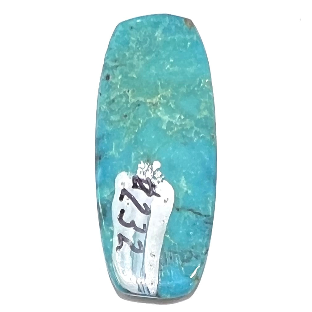 A loose, barrel shape, cabochon cut blue turquoise stone from Bisbee, Arizona.