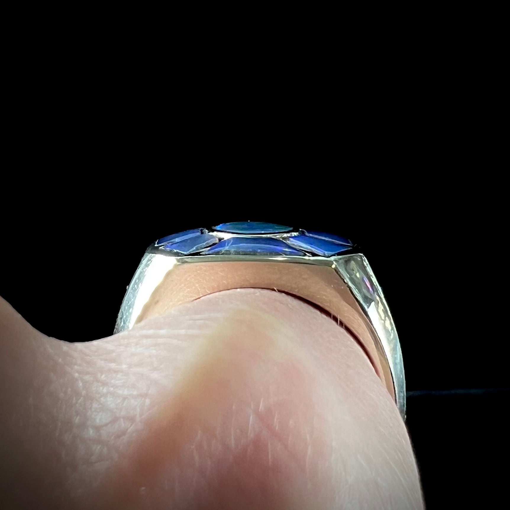 A men's white gold ring inlay set with Lightning Ridge, Austalian black crystal opal.
