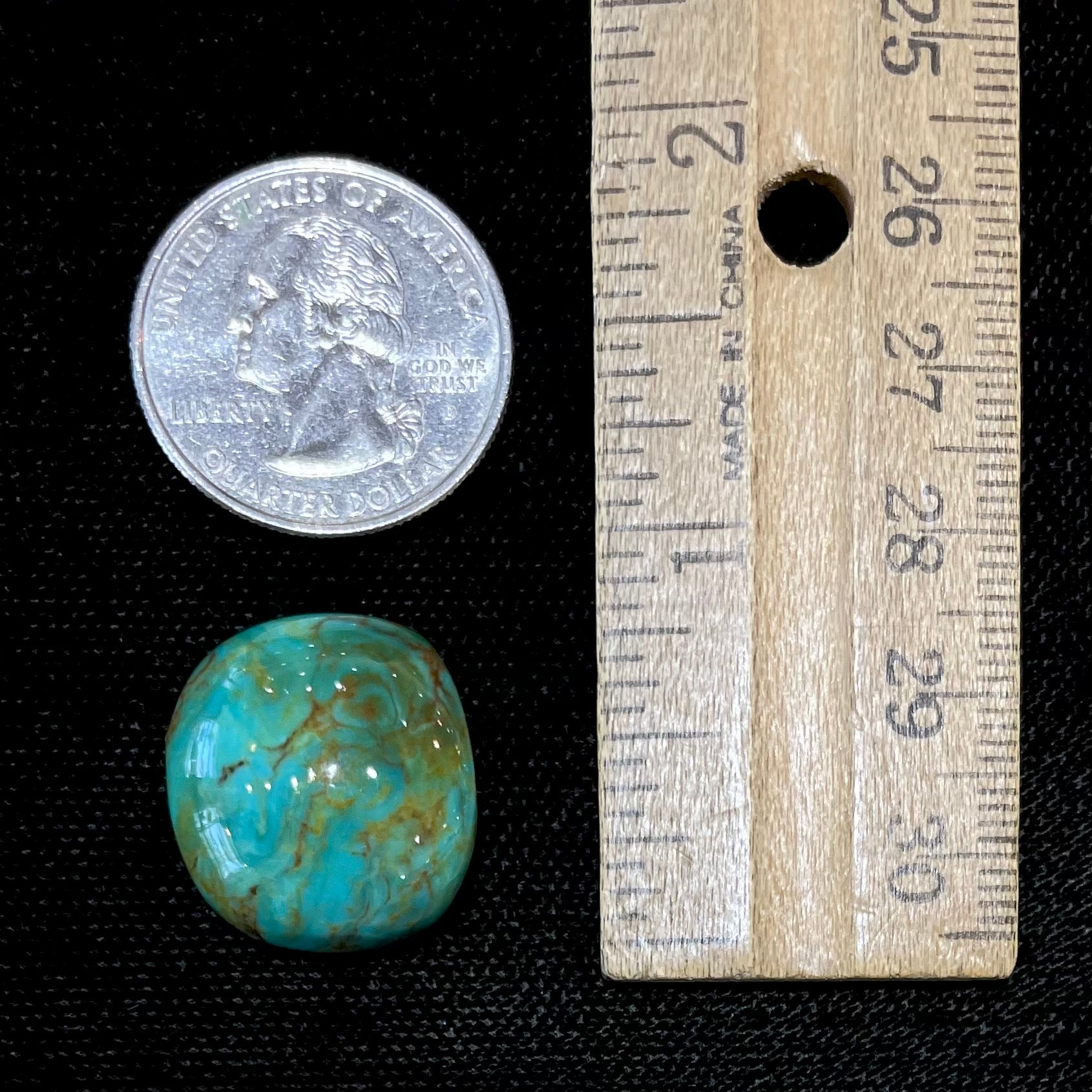 A loose, polished turquoise cabochon from Manassa, Colorado.
