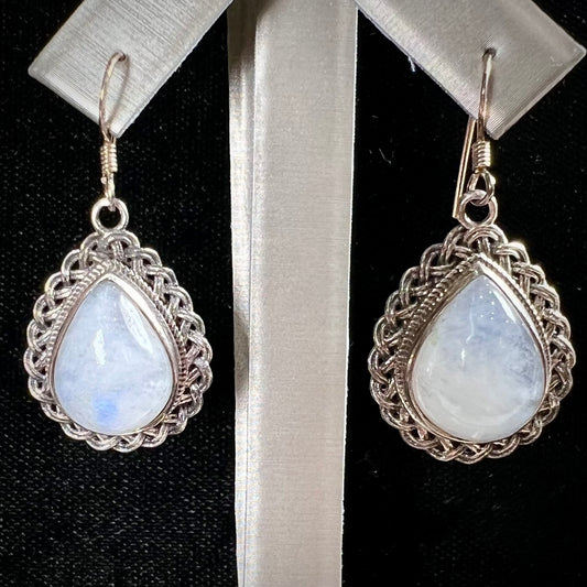 Silver filigree dangle wire earrings set with pear shape moonstones.