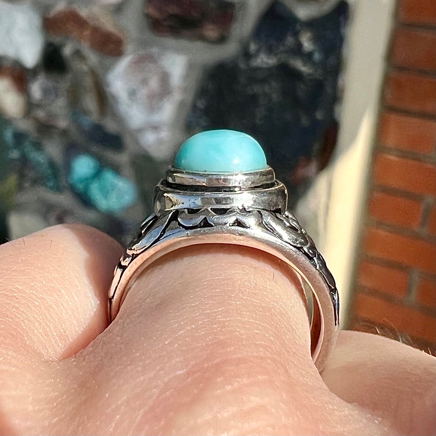 Sterling silver ring with black antiqued highlights set with blue larimar stone.