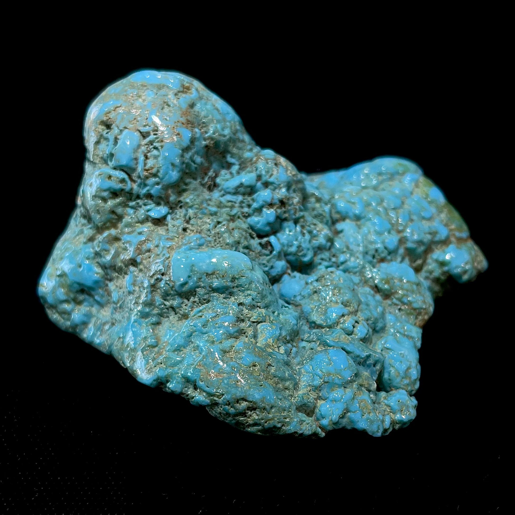 A loose, slightly polished natural turquoise nugget from Sleeping Beauty Mine, Arizona.