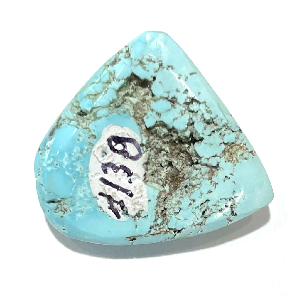 A loose, freeform cabochon cut light blue turquoise stone from Sleeping Beauty Mine, Arizona.