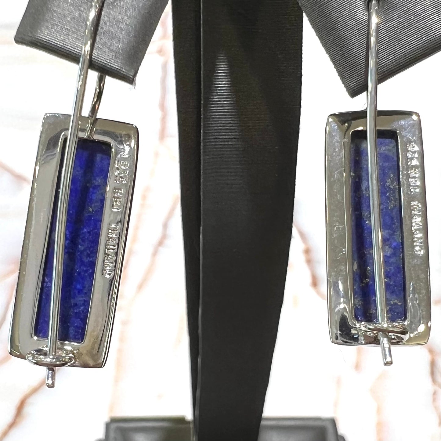 Rectangular cut lapis lazuli stones bezel set in sterling silver wire earrings.