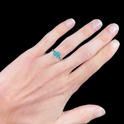 A ladies' vintage white gold solitaire ring set with a round brilliant cut blue zircon stone.