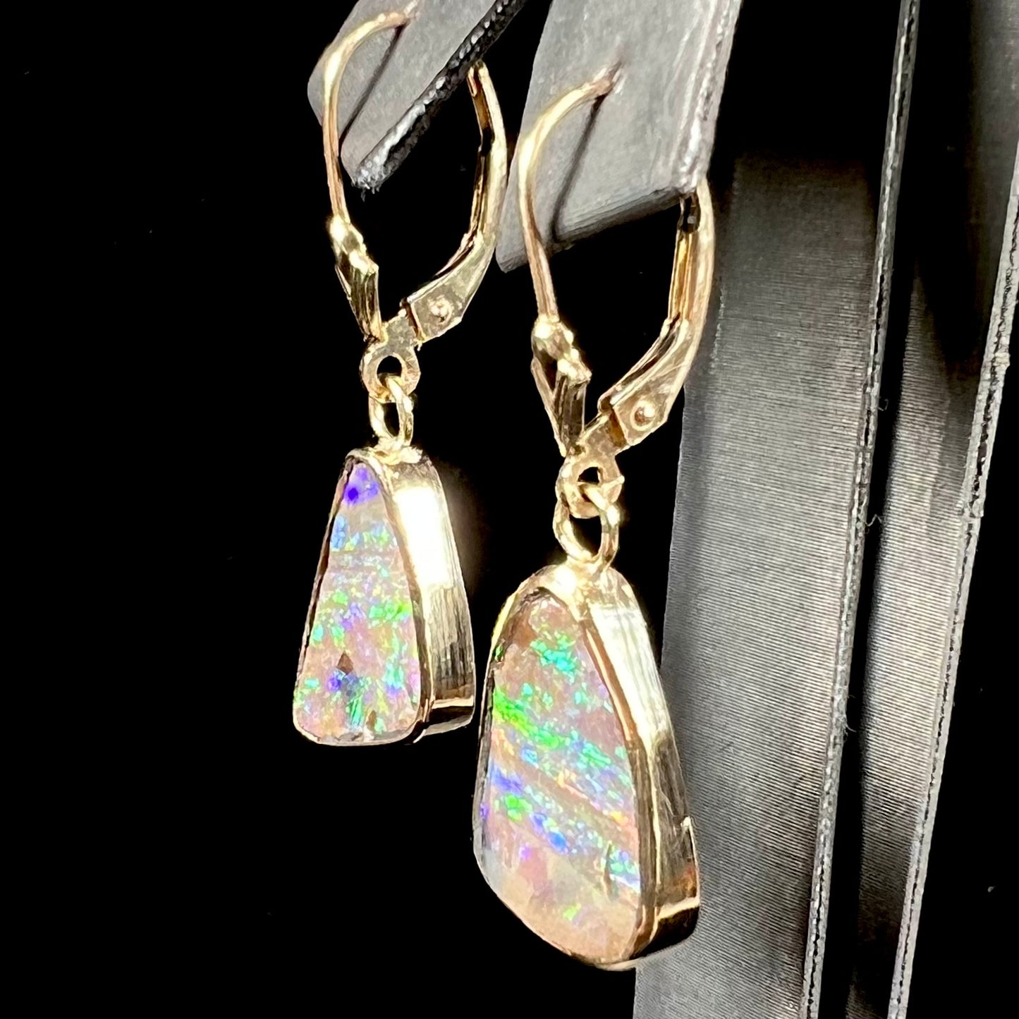A pair of Australian boulder opal dangle earrings.