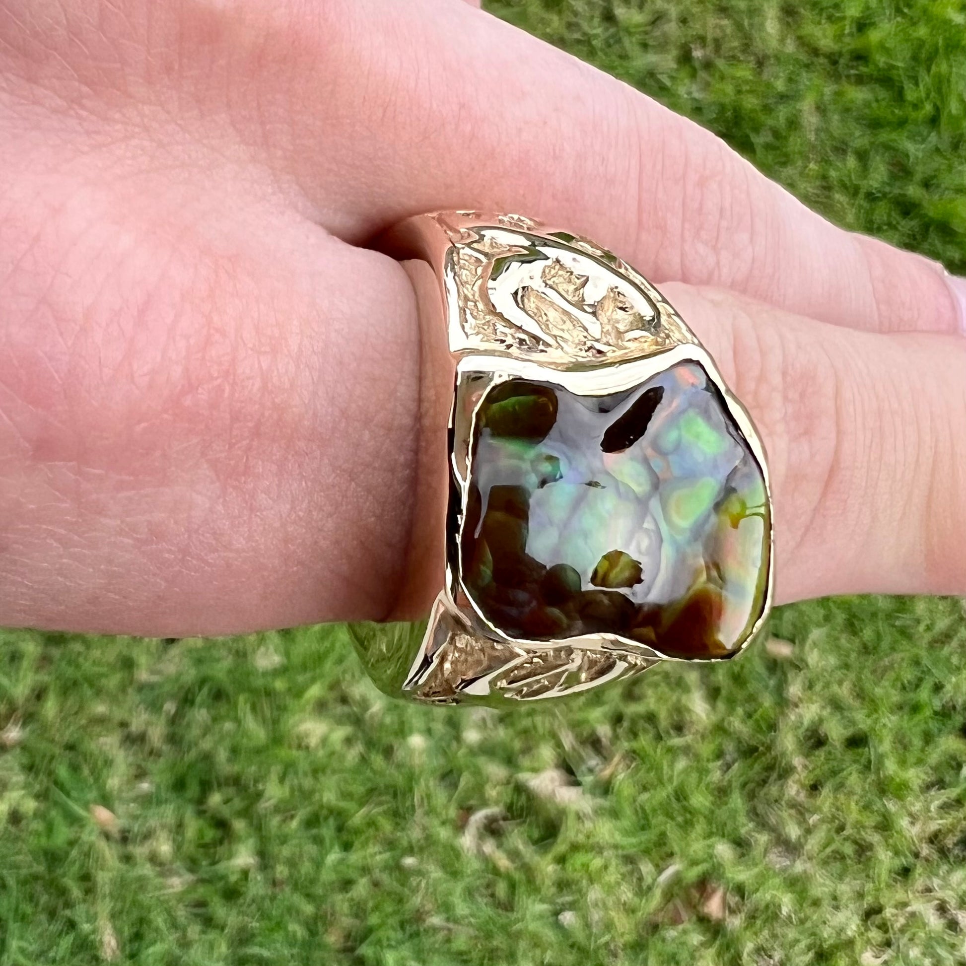 Custom, heavy yellow gold men's ring set with fire agate from Deer Creek, Arizona.