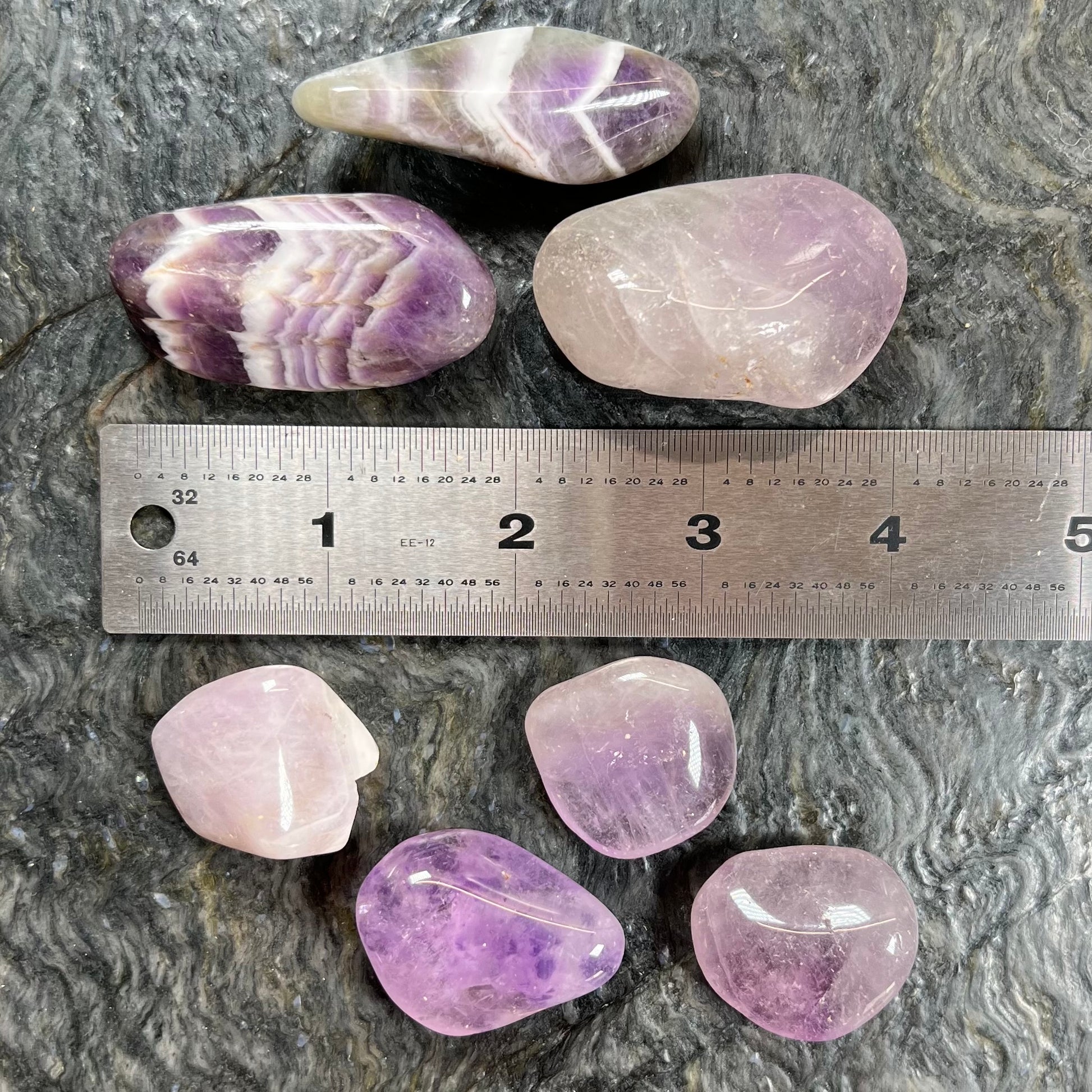 Palm sized, commercial grade, tumbled amethyst stones.