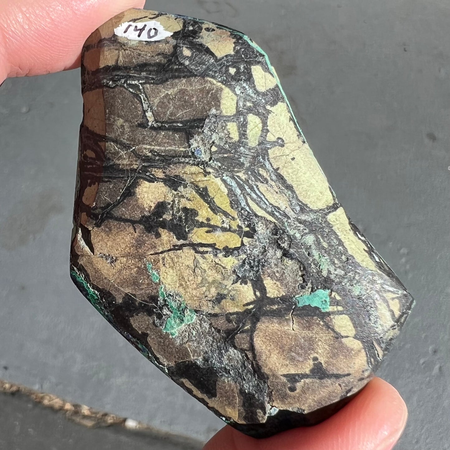 A thick polished slab of azurite with malachite inclusions.