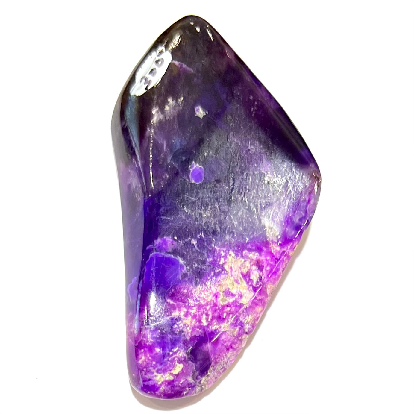 A loose, polished sugilite specimen displaying a blend of different shades of purple.