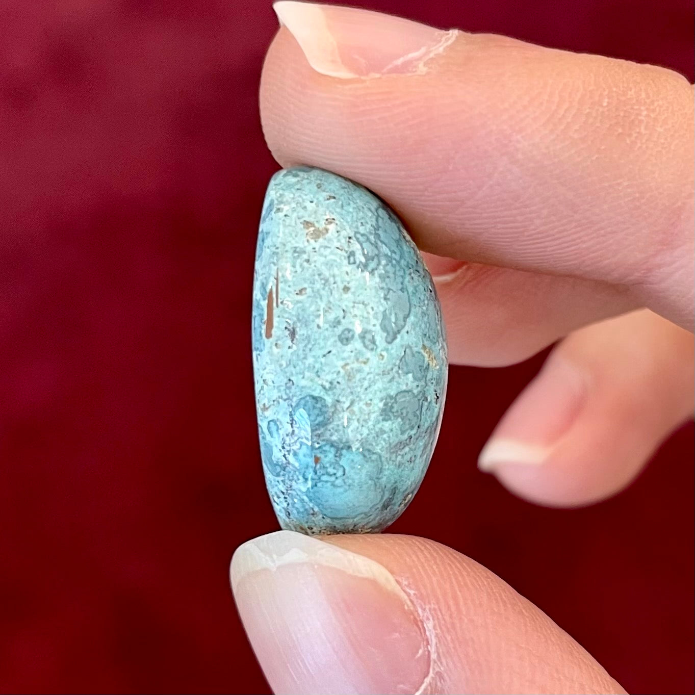 A loose, oval cabochon cut turquoise stone from Baja California.