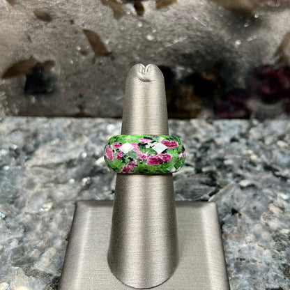 A faceted, carved stone ring made form ruby in zoisite.