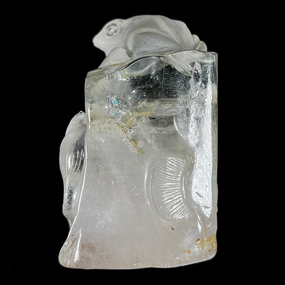 A frog carved from natural white topaz crystal.