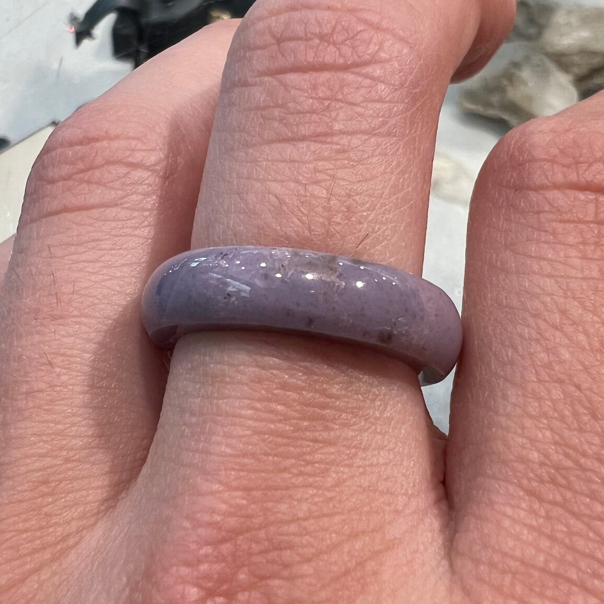 A carved lavender jade stone band.