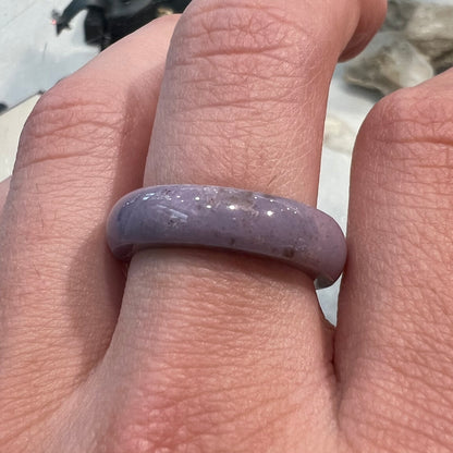 A carved lavender jade stone band.