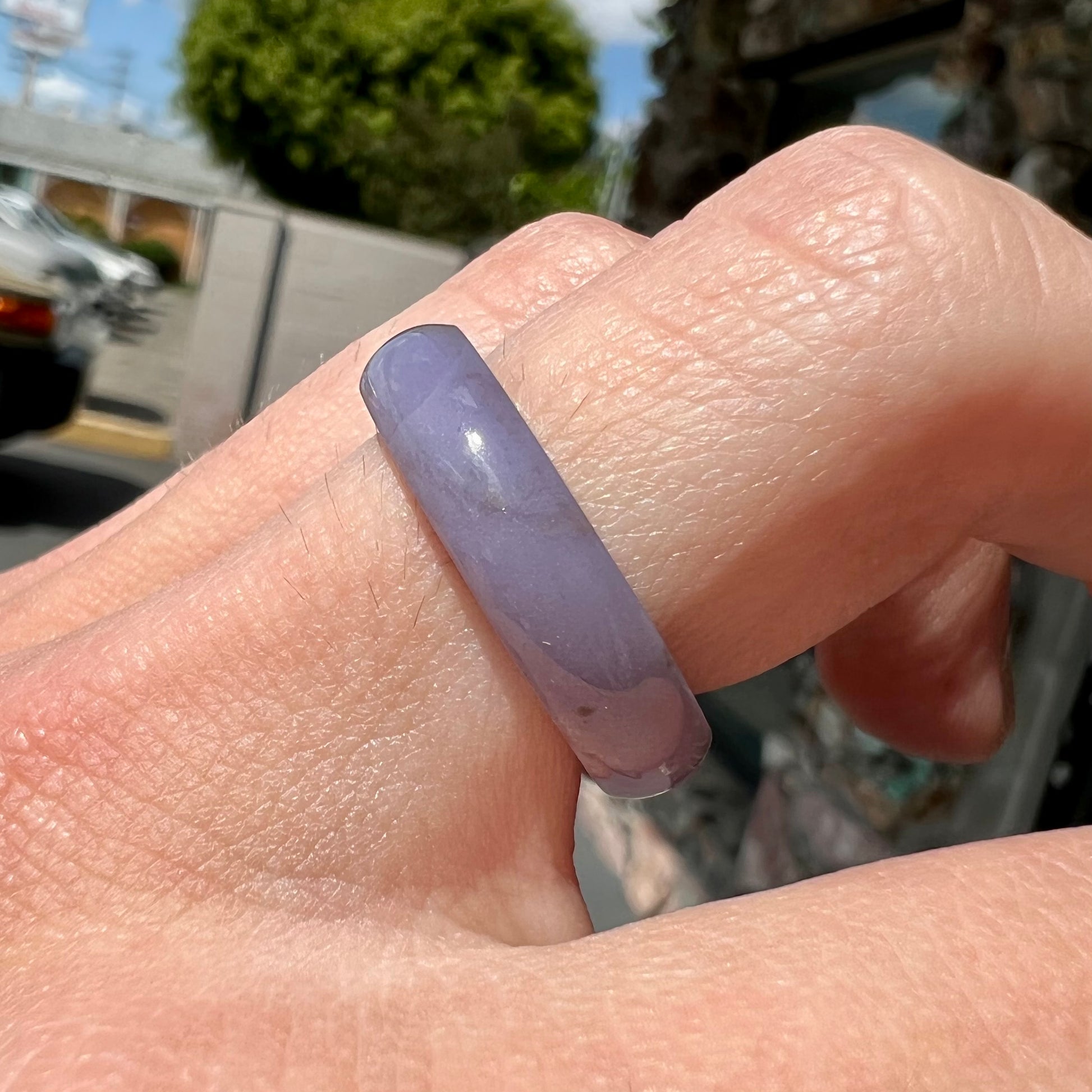 A carved lavender jade stone band.