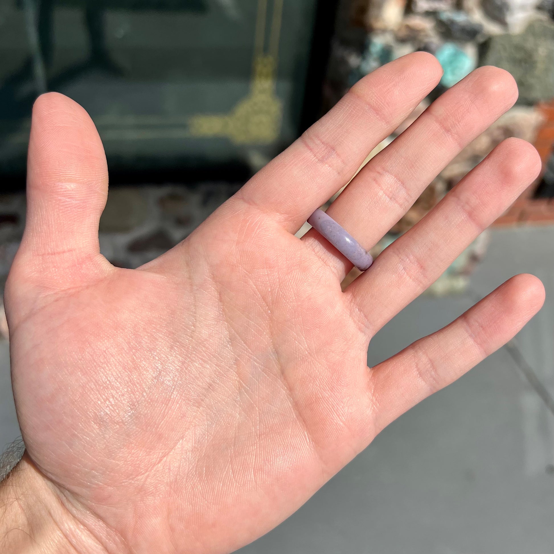 A carved lavender jade stone band.