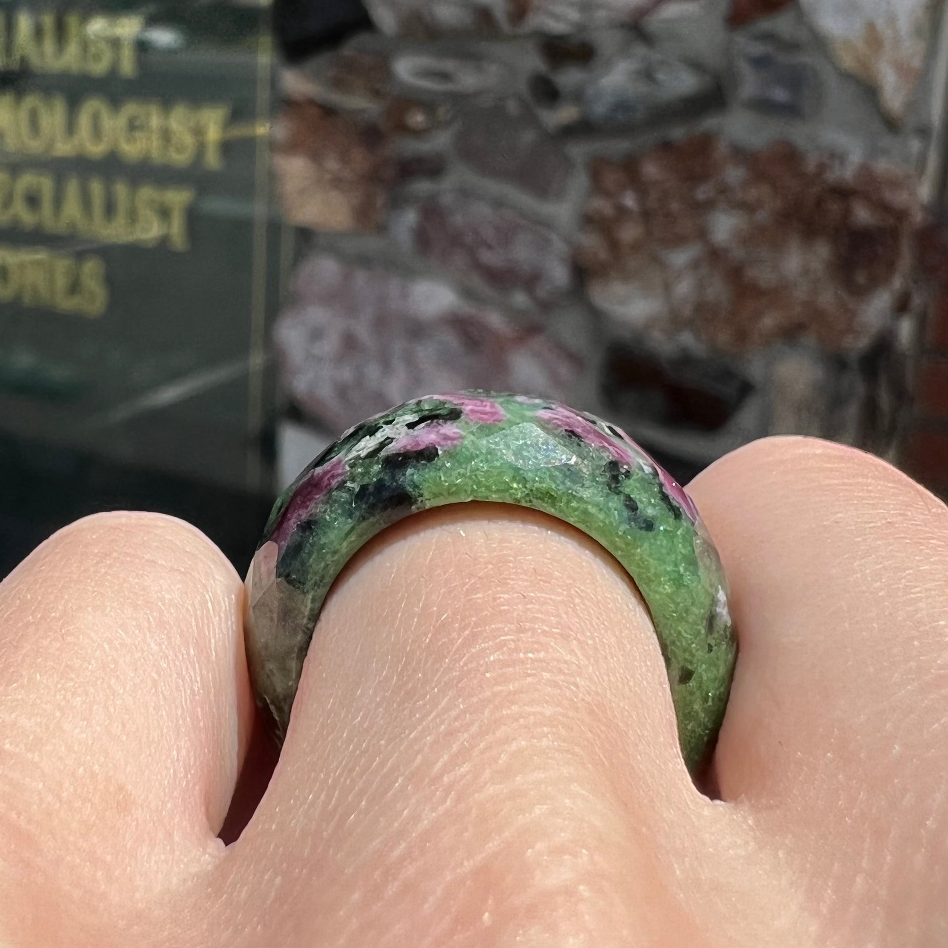 A faceted, carved stone ring made form ruby in zoisite.