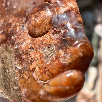 A stone fish carved from Northern Mexican fire agate.  The material is brown and white.  He do be sexy tho.
