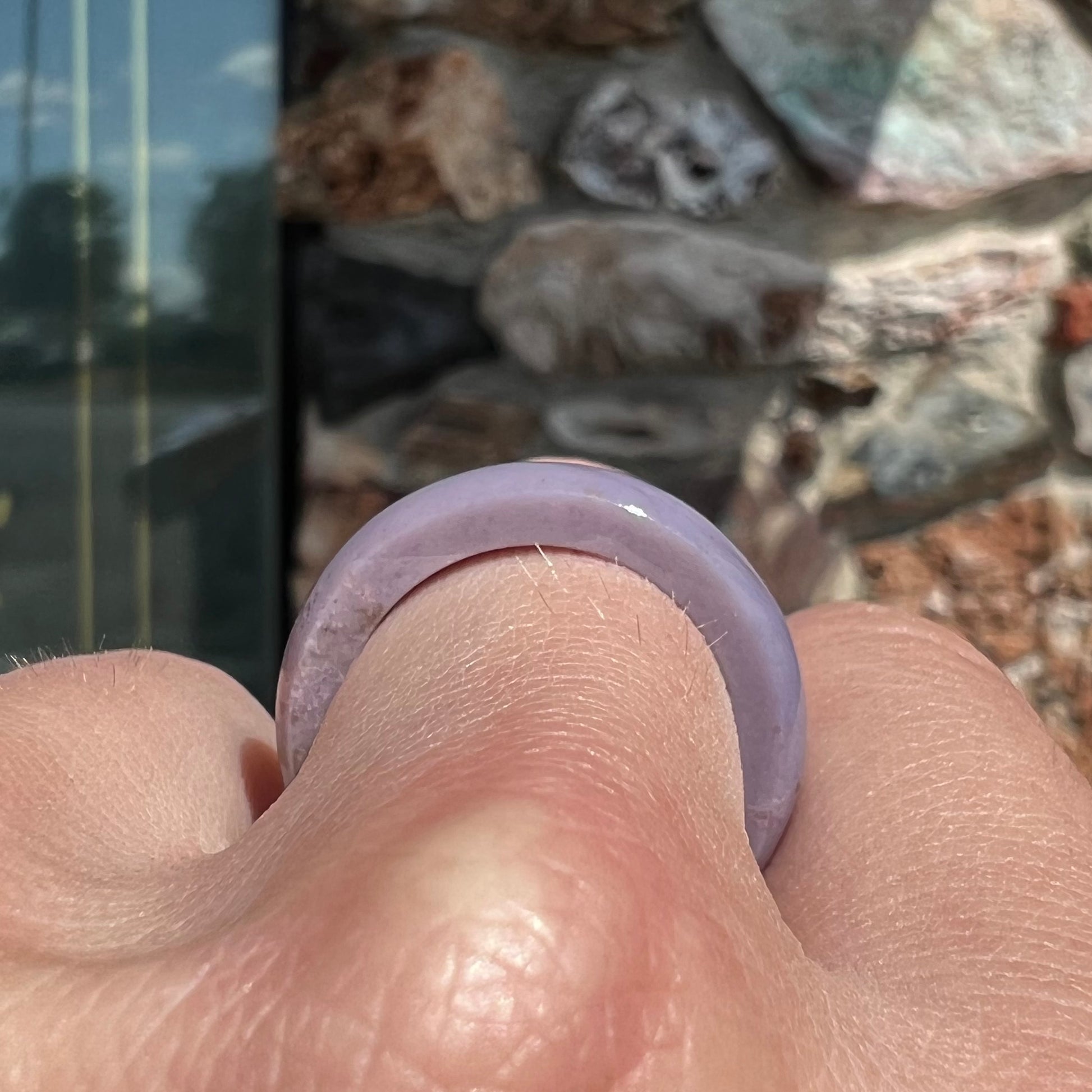 A carved lavender jade stone band.