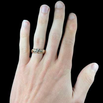 A ladies' channel set gold diamond ring.