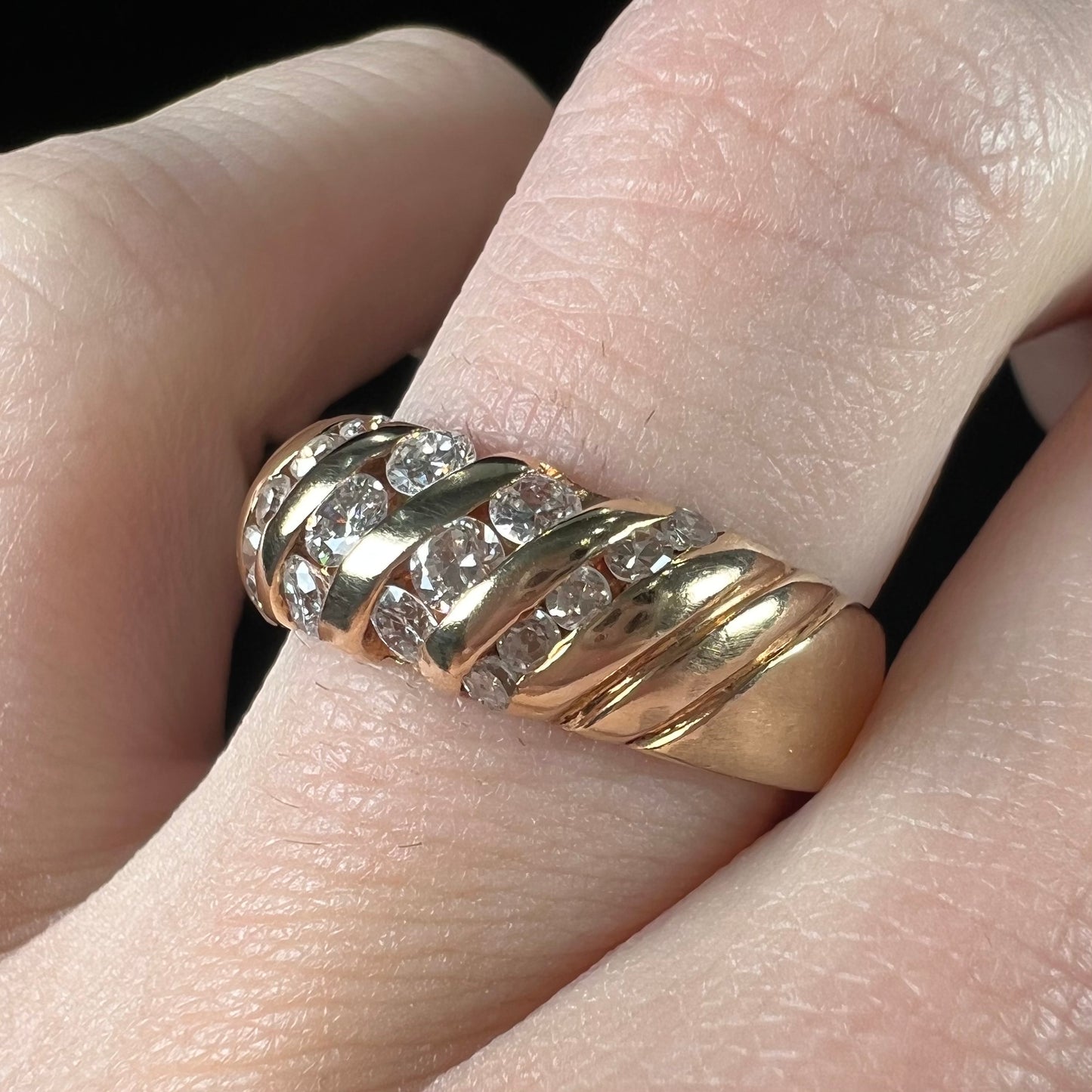 A ladies' channel set gold diamond ring.