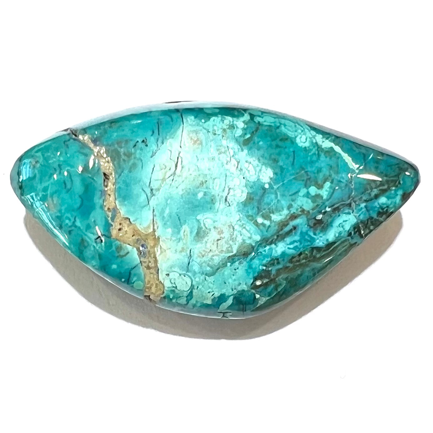 A loose chrysocolla stone with turquoise inclusions.