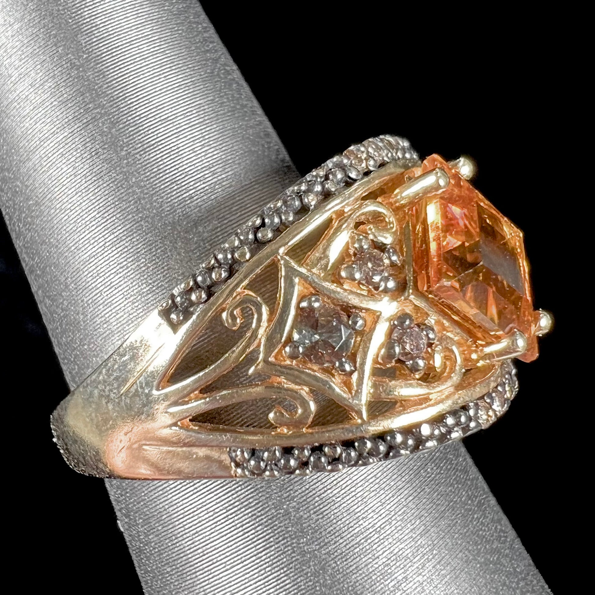 A square cut citrine and chocolate diamond filigree ring with andalusite accents.