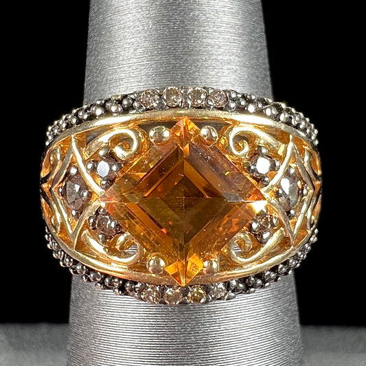 A square cut citrine and chocolate diamond filigree ring with andalusite accents.