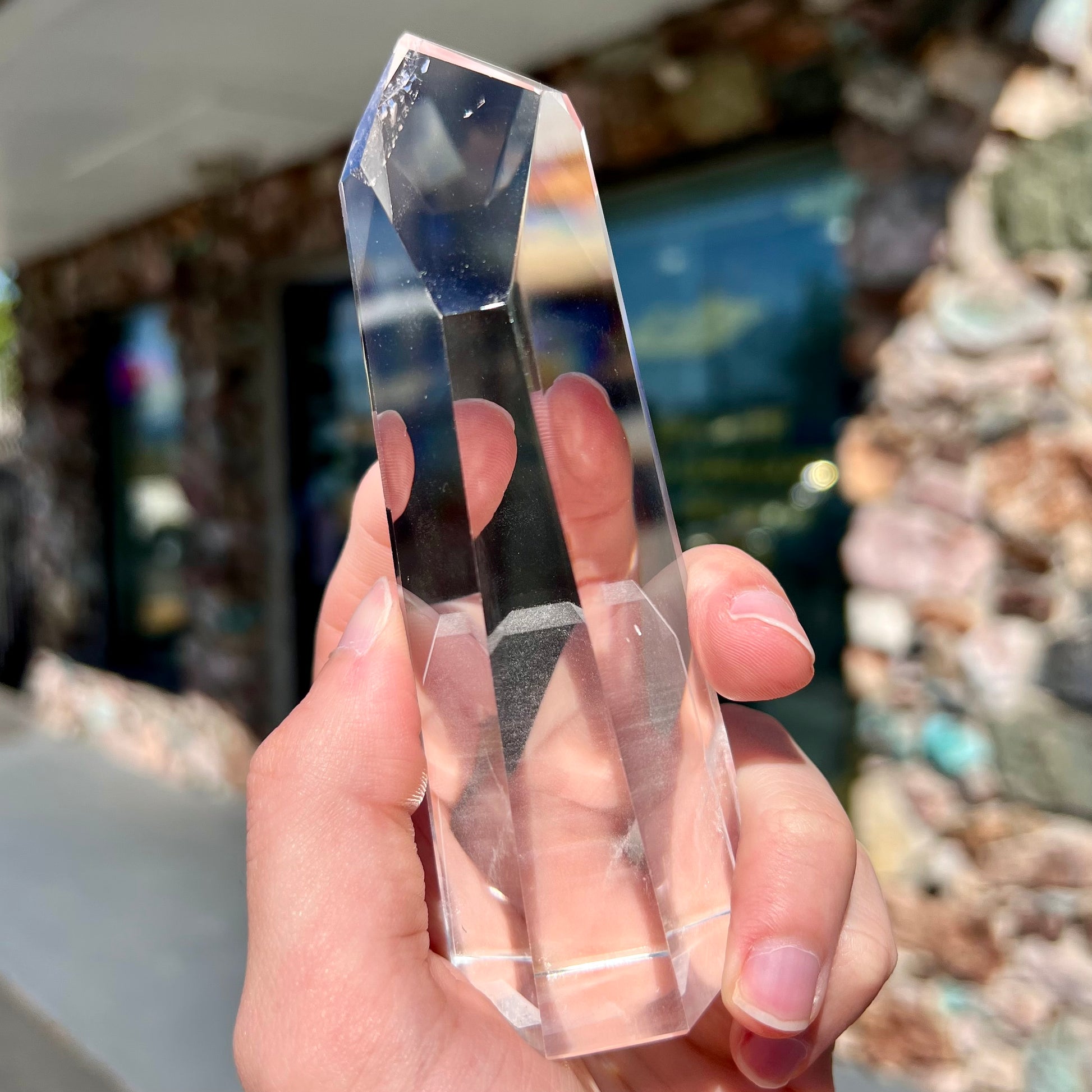 A 5.5 inch clear quartz crystal with a tabular quartz phantom inclusion.