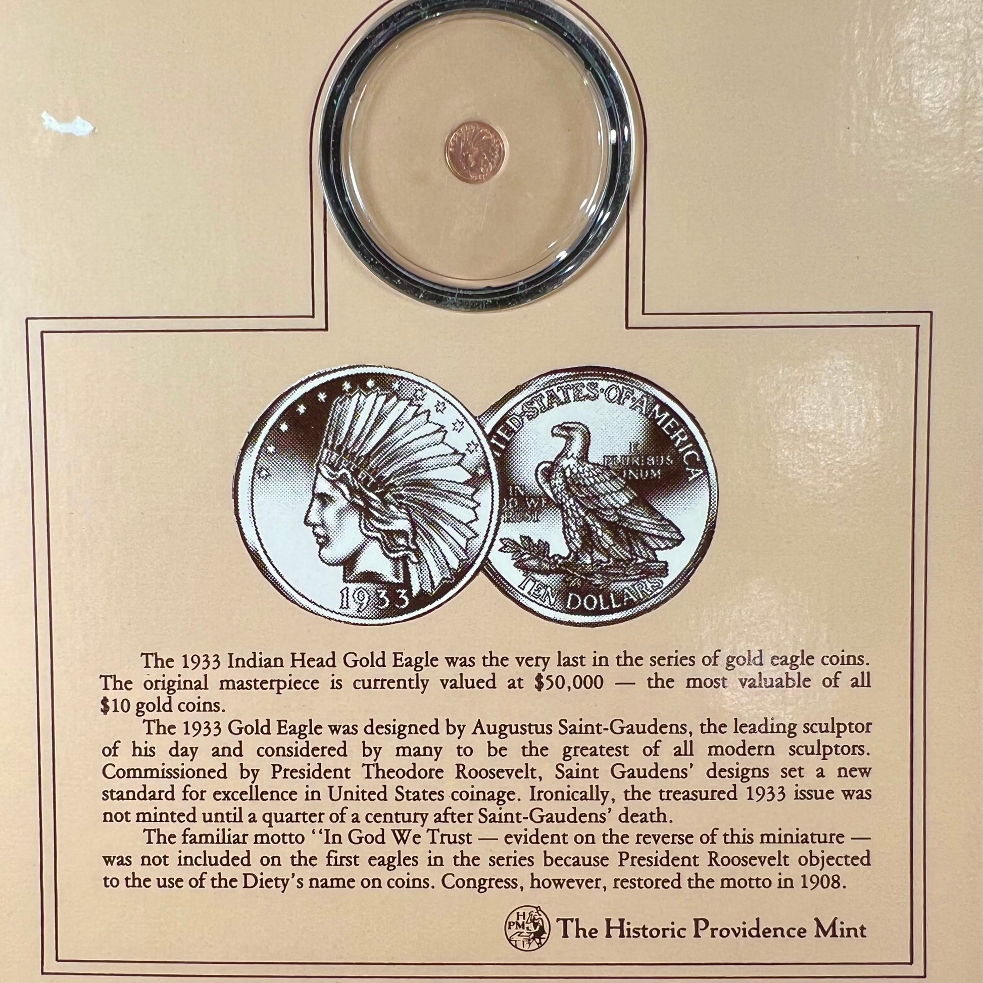 A 14 karat gold miniature commemorative of a 1933 Indian Head Gold Eagle coin.