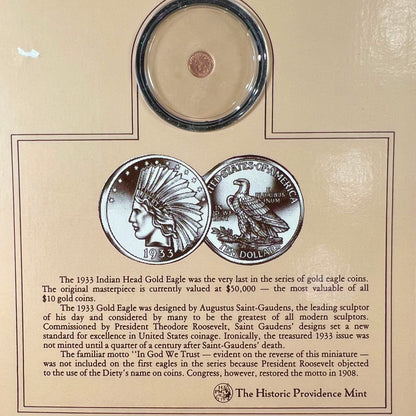 A 14 karat gold miniature commemorative of a 1933 Indian Head Gold Eagle coin.