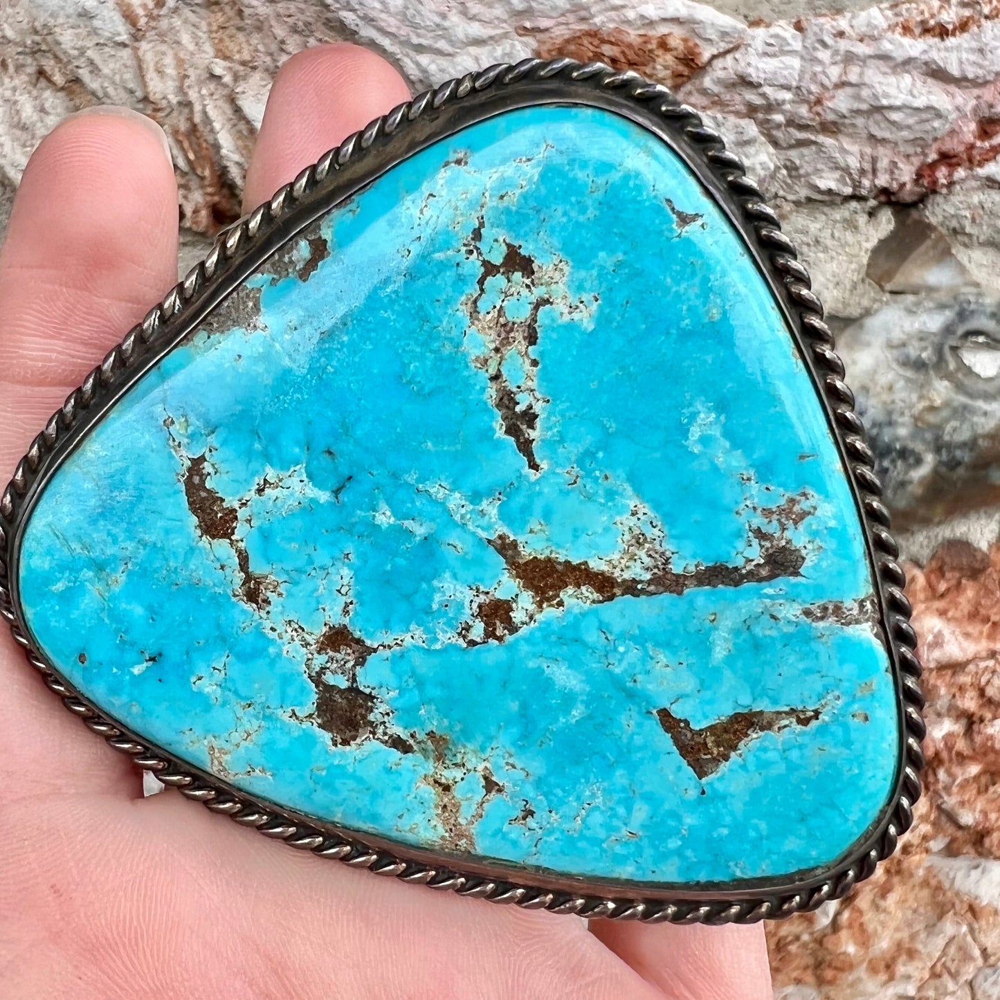 A sterling silver Morenci turquoise cuff bracelet.  The turquoise is large and has orange copper veins.