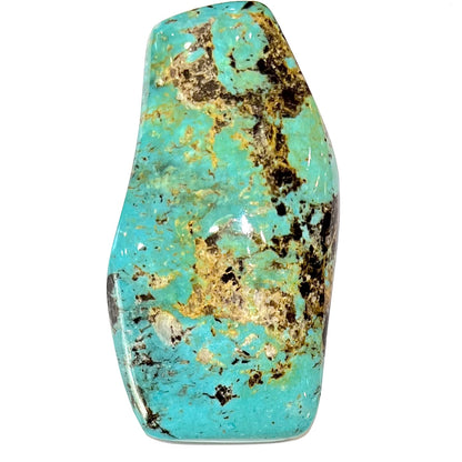 Loose turquoise stone from Cow Springs, Nevada.  Black and white matrix is visible.