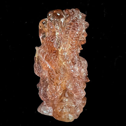 A dragon carved by Ronald Stevens from imperial topaz crystal.