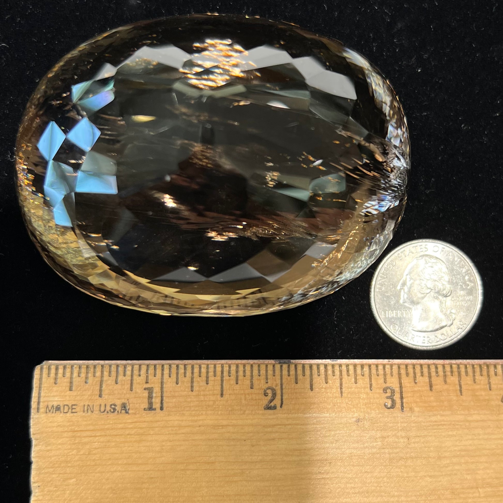 A loose, 1400+ carat smoky quartz gemstone.  The stone has a fracture that runs throughout the stone to the table.